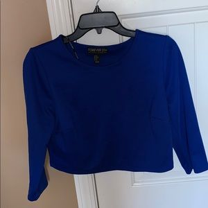 Cropped long sleeve shirt.